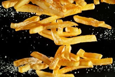 Delicious fries scattered with salt.